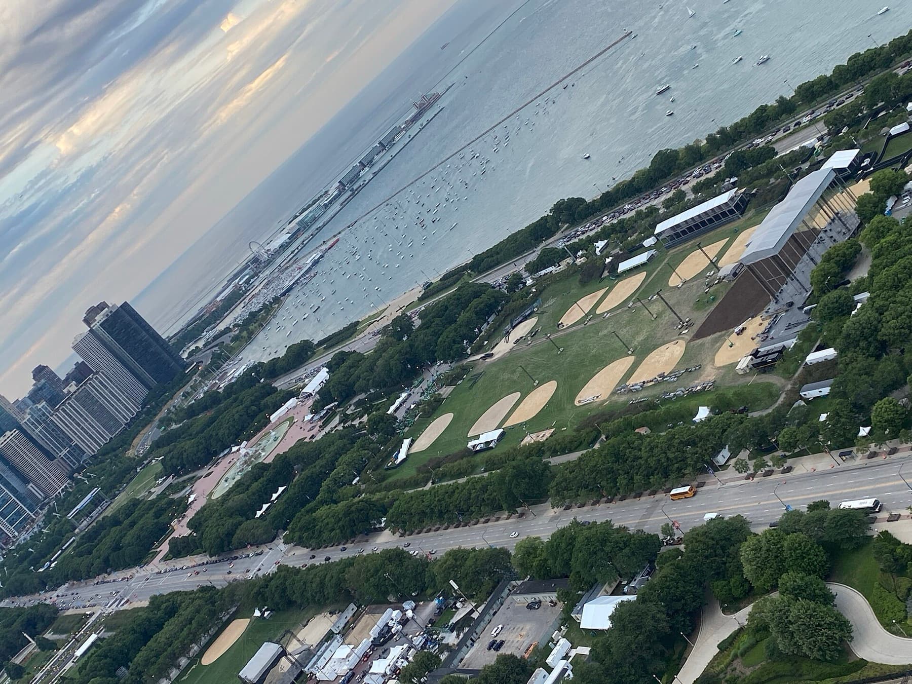 Grant Park seen from the NEMA tower on 22 July 2022, with Lollapalooza stages set up and Buckingham Fountain at centre left. The photo shows the 2022 build, not the 2026 edition.